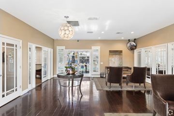San Jose apartment for rent - A dining room with a glass table and chairs.