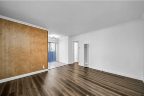 Los Angeles apartment for rent - A room with wooden floors and a wooden wall.