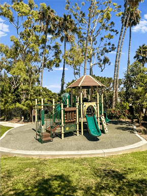 San Pedro apartment for rent - A playground with a green slide and a brown roofed structure.