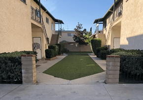 Sherman Oaks apartment for rent - A courtyard surrounded by buildings with a green lawn in the middle.