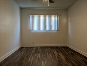 Sherman Oaks apartment for rent - A room with wooden flooring and a window with blinds.