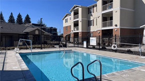 Folsom apartment for rent - A swimming pool in front of apartment buildings.