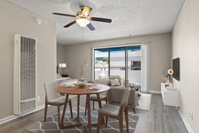 San Pedro apartment for rent - A dining room with a table set for two and a ceiling fan in a studio apartment at Harbor Terrace Apartments, California, 90731