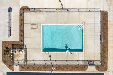 Elk Grove apartment for rent - An aerial view of a rectangular pool surrounded by a fence.