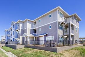 Elk Grove apartment for rent - A modern two-story apartment building with a balcony on the second floor.