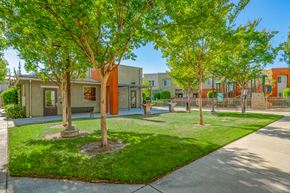 Pomona apartment for rent - a courtyard with trees and houses in the background
