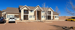 Taylor apartment for rent - a large apartment complex with a parking lot