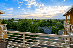 Redding apartment for rent - A balcony with a view of a town and trees.