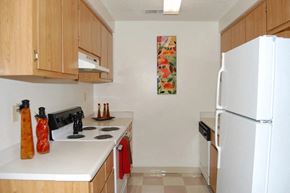 Modesto apartment for rent - a kitchen with a white refrigerator and a stove