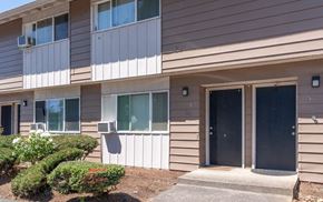 Washougal apartment for rent - a building with two doors and a sidewalk in front of it
