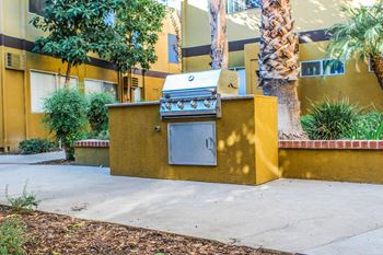 A stove on a sidewalk in front of a building