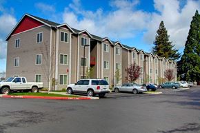 Lebanon apartment for rent - A row of apartment buildings with cars parked in front.