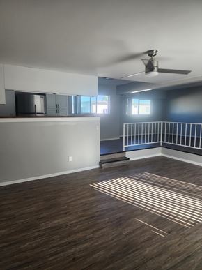 Winnetka apartment for rent - A room with a ceiling fan and wooden flooring.