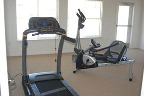 Globe apartment for rent - a treadmill and other exercise equipment in a gym