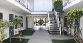 Winnetka apartment for rent - A white building with a staircase leading to the second floor.