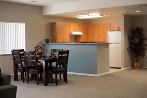 Douglas apartment for rent - a dining area with a table and chairs and a kitchen in the background