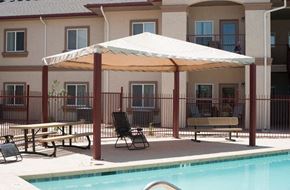 Douglas apartment for rent - a large umbrella sitting next to a swimming pool