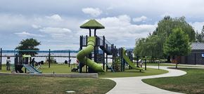 Kirkland apartment for rent - A playground with a green slide and a walkway.