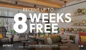 Woodinville apartment for rent - A man is sitting on a couch in a living room with a sign offering up to 8 weeks free.