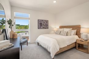 Woodinville apartment for rent - a bedroom with a large bed and a window