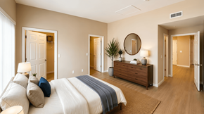 Kirkland apartment for rent - A bedroom with a large bed and a wooden dresser.