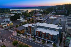 Kenmore apartment for rent - A city street with a building in the middle of it.