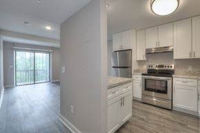 Nashville townhouse for rent - A kitchen with white cabinets and stainless steel appliances.