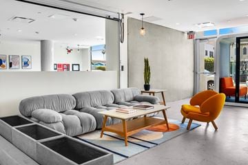 Los Angeles apartment for rent - a living room with a gray couch and a coffee table