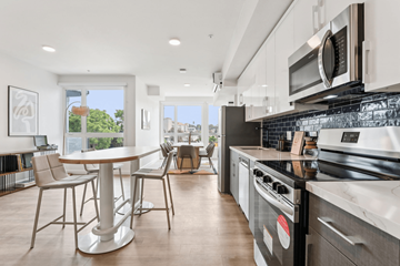 Los Angeles apartment for rent - A modern kitchen with a dining table and chairs.