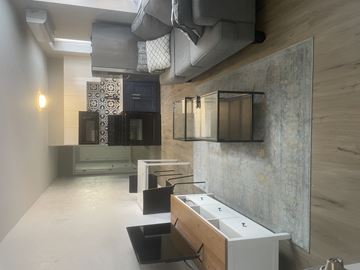 Philadelphia apartment for rent - A living room with a grey couch and a coffee table.