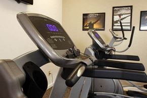 Wichita apartment for rent - a treadmill in a gym with some exercise equipment