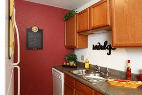 Wichita apartment for rent - a kitchen with a sink and a refrigerator