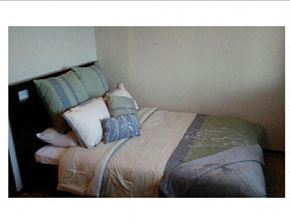 Wichita apartment for rent - a bedroom with a bed and pillows on it