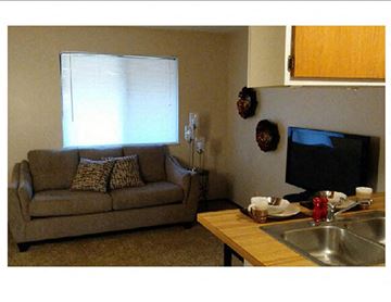 Wichita apartment for rent - a living room with a couch and a television