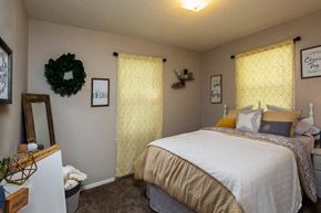 Wichita apartment for rent - a bedroom with a bed and a window
