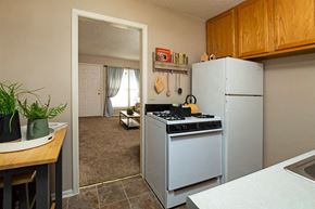 Wichita apartment for rent - a kitchen with a stove and a refrigerator