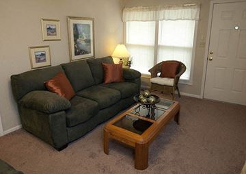 Wichita apartment for rent - a living room with a couch and a coffee table