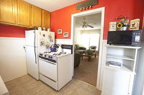 Wichita apartment for rent - a kitchen with a stove refrigerator and a microwave