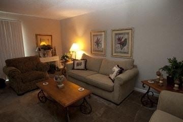 Wichita apartment for rent - a living room with a couch and two chairs