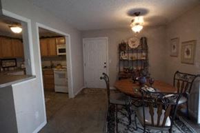 Wichita apartment for rent - a kitchen and dining room with a table and chairs