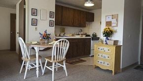 Wichita apartment for rent - a kitchen and dining room with a table and chairs