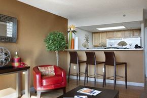 Wichita apartment for rent - a living room with a bar and a kitchen