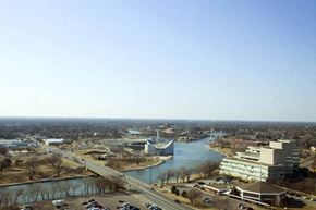 Wichita apartment for rent - an aerial view of a city with a river and buildings
