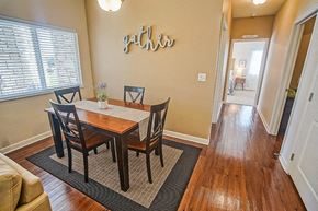 Wichita apartment for rent - a dining room with a wooden table and chairs