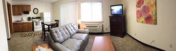 Wichita apartment for rent - a living room with a couch and a tv