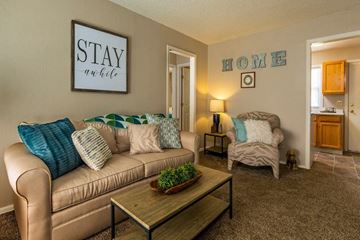 Wichita apartment for rent - a living room with a couch and a coffee table