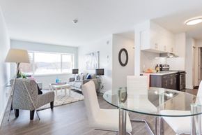 Gatineau apartment for rent - a living room and dining room with a glass table