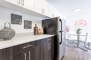 Gatineau apartment for rent - a kitchen with a refrigerator and a table