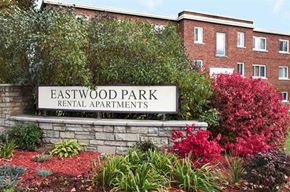 Ottawa apartment for rent - a sign for eastwood park in front of a building
