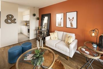 Ottawa apartment for rent - A living room with a white couch and a coffee table.